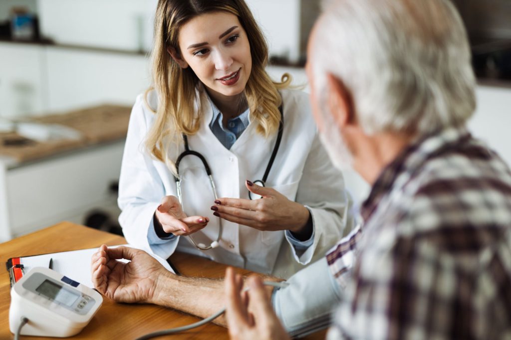 doctor helping a patient